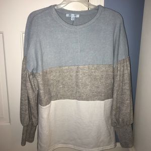 Blue, grey and white long sleeve sweater.